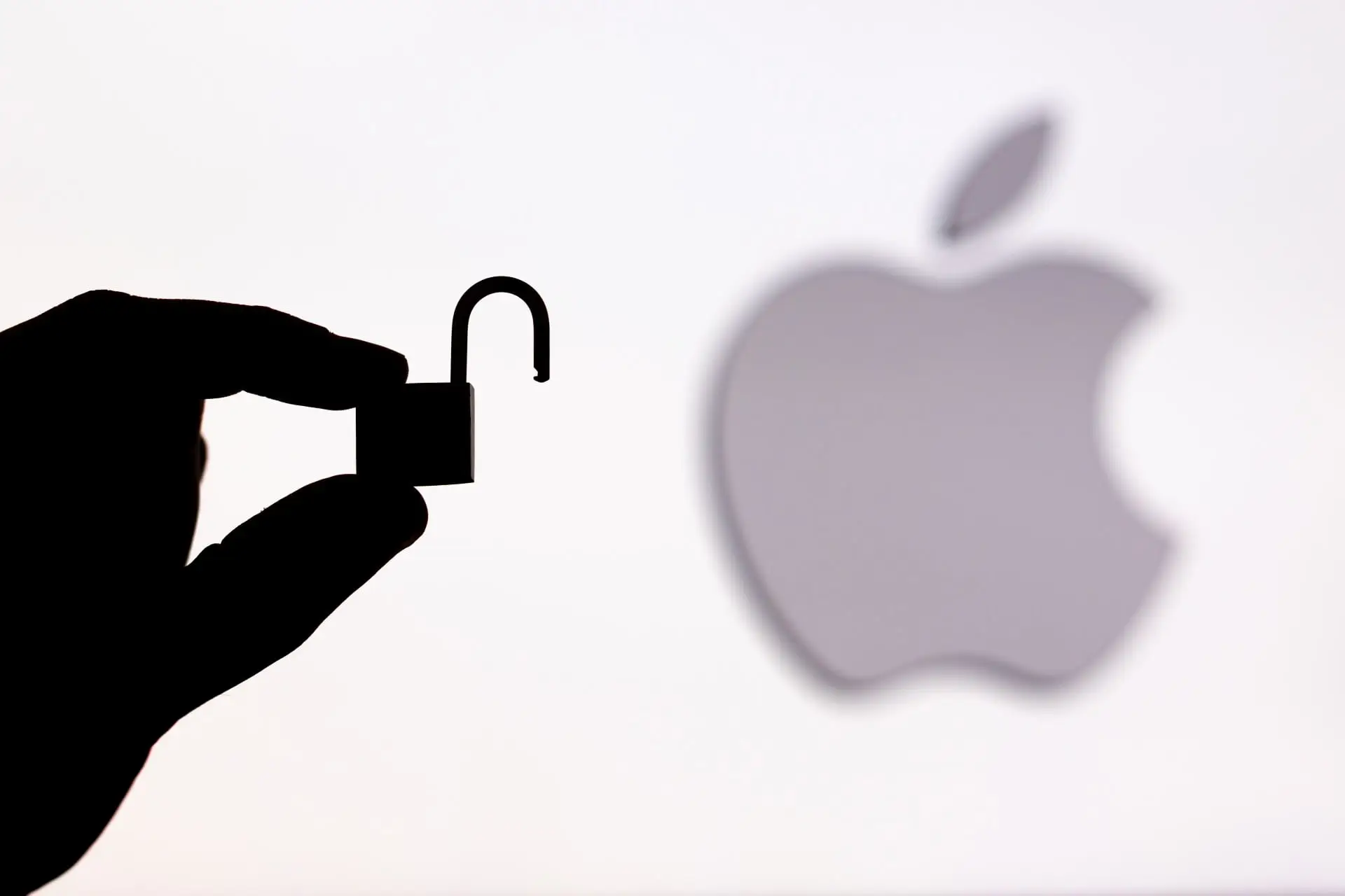lock silhouette in front of apple logo